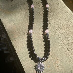 11” from clasp to bottom of sun rays. Shines beautifully in the sun ☀️